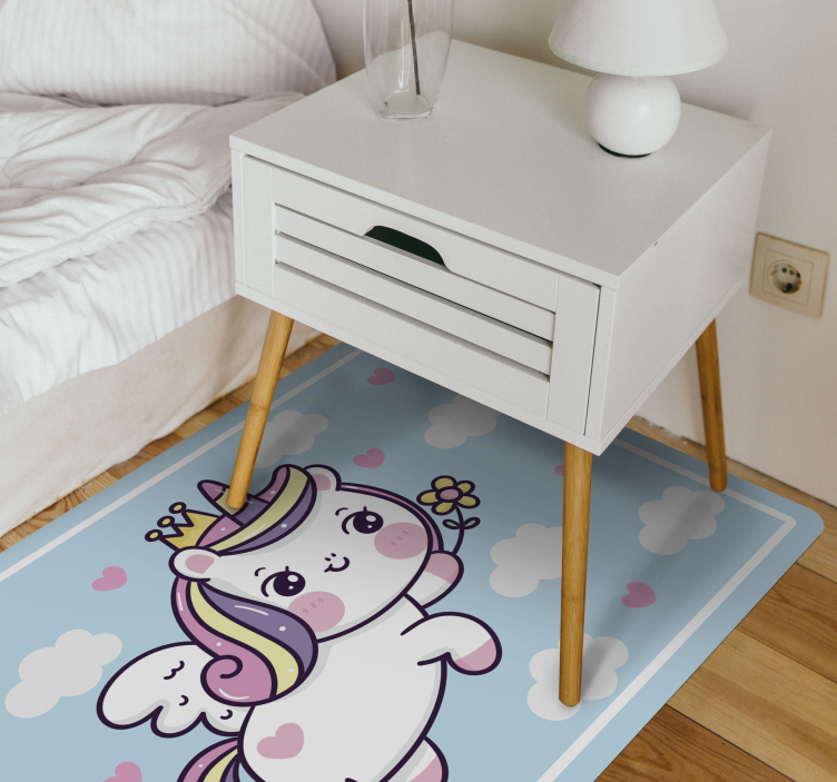 Baby unicorn on rainbow kids play mat - TenStickers
